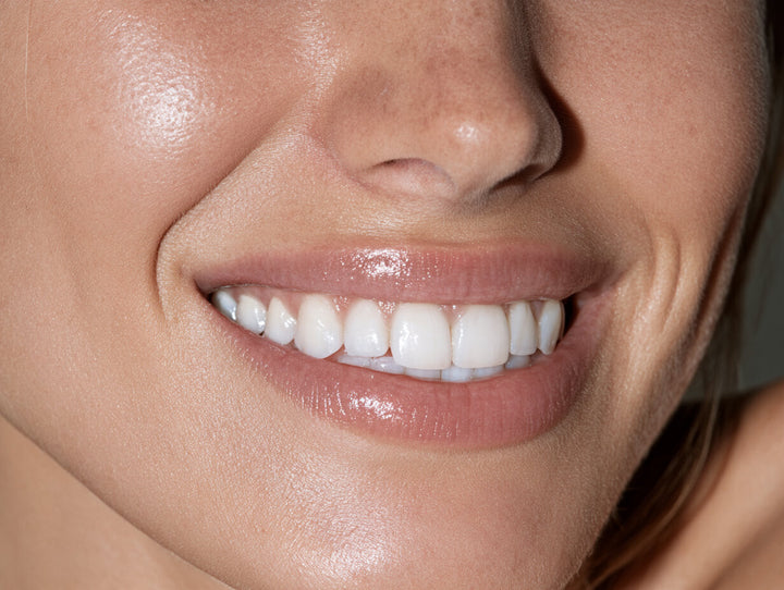 Klyyr hydroxyapatite toothpaste — Close view of a natural healthy smile